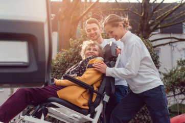 young man and woman assessing the elderly